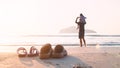 Rubber slippers on the beach with freedom father and daughter standing and watching the sunrise Royalty Free Stock Photo