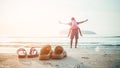 Rubber slippers on the beach with freedom father and daughter standing and watching the sunrise Royalty Free Stock Photo