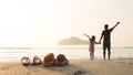 Rubber slippers on the beach with freedom father and daughter standing and watching the sunrise.16:9 style Royalty Free Stock Photo