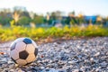 A rubber soccer ball lies on a stone path Royalty Free Stock Photo