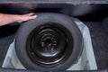 Rubber spare tire removed the trunk of a car