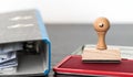 rubber stamp on ink pad on wooden desk Royalty Free Stock Photo