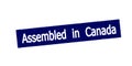 Stamp with text Assembled in Canada