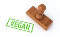 Rubber stamp vegan on white background