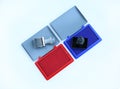 Rubber stamper and Red - Blue Ink cartridges on white background