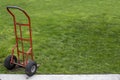 Two wheel red utility cart hand truck to move heavy boxes and things for business or for consumer