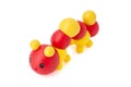 Rubber toy caterpillar on a white background. Child`s toy isolated over white background