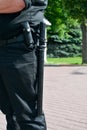 Rubber truncheon on policeman's belt