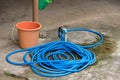 Rubber tube connected to old water tap on the floor Royalty Free Stock Photo