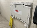 Rubbermaid baby changing station inside of a mens restroom