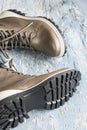 Rubbery bottom of winter boots or shoes with shoelaces on blue