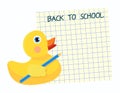 A rubbery yellow duck with a simple blue kardash on the wing and an open checkered sheet from Royalty Free Stock Photo
