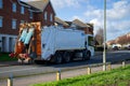 a rubbish bin collection lorry or rubbish lorry on the road moving