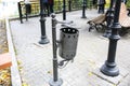 Rubbish bin outdoors. Old fashioned metal containers. Street in autumn Royalty Free Stock Photo