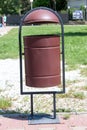 Rubbish bin on the street a background of grass Royalty Free Stock Photo