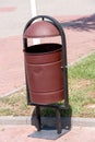 Rubbish bin on the street a background of grass Royalty Free Stock Photo