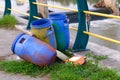 Rubbish bin in an unkempt park with rubbish underneath Royalty Free Stock Photo