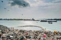 Rubbish dump view full of smoke, litter, plastic bottles,rubbish and trash at the Thilafushi local tropical island Royalty Free Stock Photo