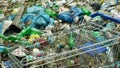 OLOMOUC, CZECH REPUBLIC, JANUARY 2, 2019: Rubbish forest shopping cart black dump waste and landscape garbage bags of