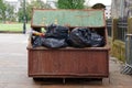 Rubbish and garbage in skip for disposal at dump site Royalty Free Stock Photo