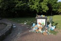 Rubbish next to rubbish bin in park Royalty Free Stock Photo