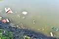 Rubbish, waste floating in polluted pond