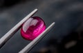 Rubellite gemstone jewelry photo with dark lighting background Royalty Free Stock Photo