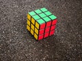 Rubik's Colored Cube on Ruberoid Grain Surface