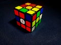 A Rubik\'s Cube set against a black background, depicted in a 3D perspective. Royalty Free Stock Photo
