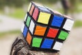 The Rubik`s cube on blurred background. Rubik`s cube was invented by Hungarian architect Erno Rubik in 1974.