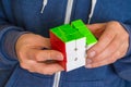 Rubik`s cube in female hands - game for solving problems Royalty Free Stock Photo