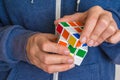 Rubik`s cube in female hands - game for solving problems Royalty Free Stock Photo