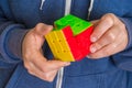 Rubik`s cube in female hands - game for solving problems Royalty Free Stock Photo