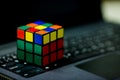 Rubik`s cube on laptop. techincal and business solving problem Royalty Free Stock Photo