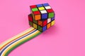 Rubik`s cube on a rainbow of paper quilling