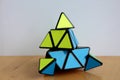Rubik`s Pyraminx Cube on a Table