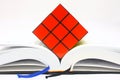 Rubiks Cube on Open Book Royalty Free Stock Photo