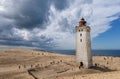 Rubjerg Knude Lighthouse on the coast of the North Sea in the Jutland in northern Denmark. Natural landscape with sand