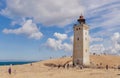 Rubjerg Knude Lighthouse on the coast of the North Sea in the Jutland in northern Denmark. Natural landscape with sand