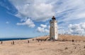Rubjerg Knude Lighthouse on the coast of the North Sea in the Jutland in northern Denmark. Natural landscape with sand