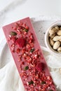 Ruby chocolate with fruits and pistachios Royalty Free Stock Photo