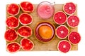 Ruby grapefruit still life with juice and juicer