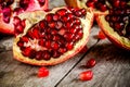 Ruby juicy pomegranate grains closeup on a table