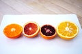Ruby red blood oranges, navel oranges, and clementines cut in half Royalty Free Stock Photo