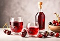 The ruby-red cherry liqueur is elegantly poured into delicate glasses. Royalty Free Stock Photo