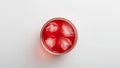 Ruby Red Refreshment A Chilled Drink with Textured Ice Cubes, Minimalist Presentation. Royalty Free Stock Photo