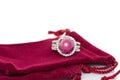 Ruby stone with diamonds ring on red velvet bag. Collection of natural gemstones accessories. Studio shot Royalty Free Stock Photo
