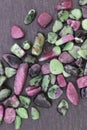 Ruby zoisite rare stones texture on black stone background Royalty Free Stock Photo