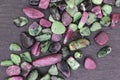 Ruby zoisite rare stones texture on black stone background Royalty Free Stock Photo