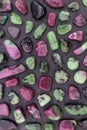 Ruby zoisite rare stones texture on black stone background Royalty Free Stock Photo